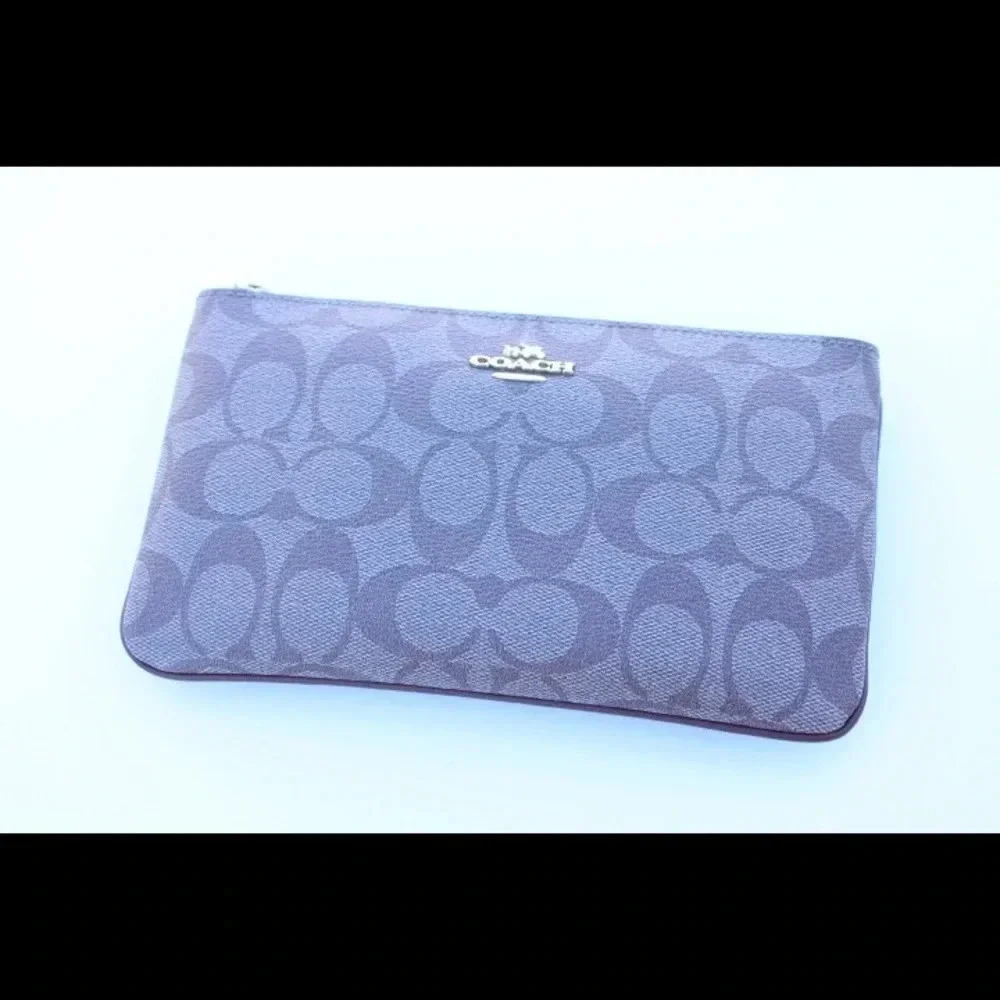 Coach signature logo cluth